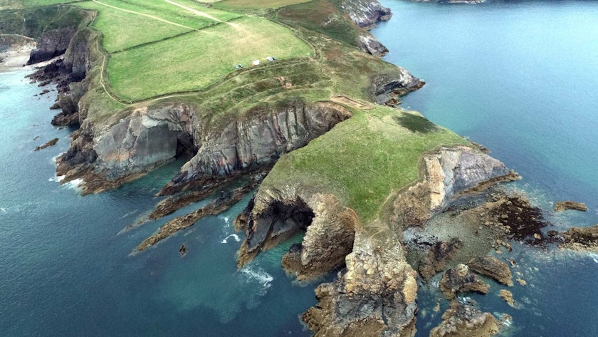 An archaeological excavation supported by CHERISH on the eroding isthmus at Caerfai Iron Age promontory fort, Pembrokeshire.