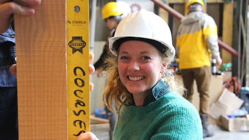 Women holding a spirit level